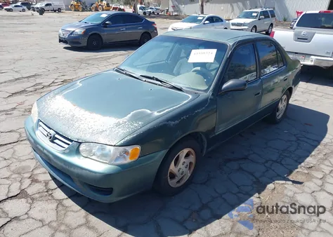 2001 Toyota Corolla Le z USA, uszkodzony, nr VIN 1NXBR12E21Z437985